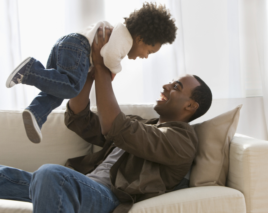 Father holding a son above his head